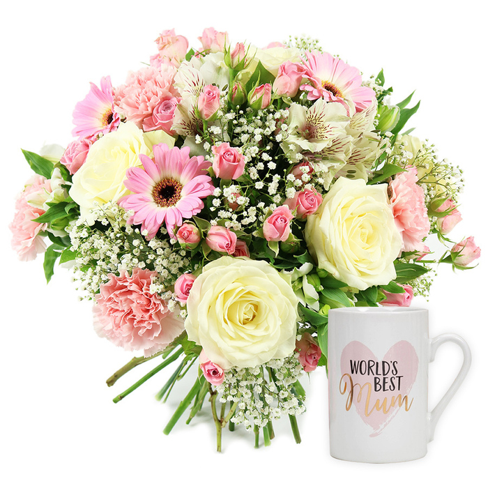 In this softly lit studio image, a thoughtfully coordinated gift set is displayed against a white background, allowing every detail to be clearly seen. On the left, a full, rounded bouquet of fresh flowers has been hand-tied with the care you would expect from an experienced local florist serving Queensbury's close-knit families. At the centre sit several creamy roses, their petals spiralling outwards in layered whorls, each bloom just shy of being fully open. Around them, bright pink gerbera daisies with dark, velvety centres provide a modern, uplifting note, their daisy faces drawing the eye. Pale blush carnations, with their frilled and feathery edges, nestle closely between the larger blooms, adding a sense of texture and depth. Threaded through the bouquet are slender, trumpet-shaped white alstroemeria, each petal finely streaked with reddish-brown markings, alongside numerous tiny sprays of gypsophila that appear like sparkling white stars against the pastel tones. A scattering of fresh green foliage emerges between the flowers, offering contrast and echoing the natural greenery seen in local gardens and small parks around Queensbury. The stems, gathered neatly at the base, indicate a hand-tied design ready to be placed in a favourite vase at home. To the right of the bouquet stands a pristine white ceramic mug with a smooth, gently curved form. On its front, a soft pink, watercolour-style heart provides a gentle backdrop for the text. The words WORLD'S BEST are printed in clear black capitals above Mum, which appears in an elegant, shimmering gold or rose-gold script, giving a warm, personal touch. The overall composition suggests a heartfelt Mother's Day or birthday surprise, ideal for same-day delivery to addresses around Queensbury as a visible expression of love, admiration, and thanks.