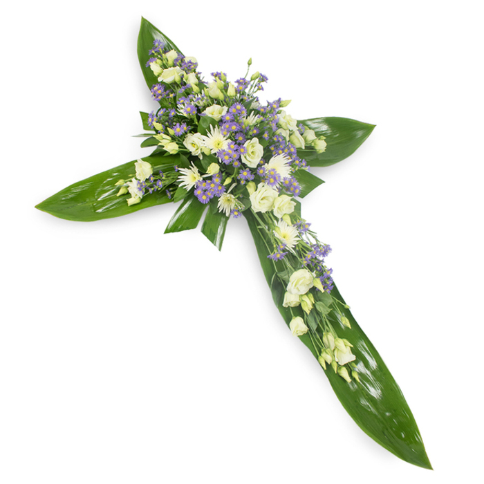 This heartfelt cross arrangement is presented on a plain white background and viewed from a slight overhead perspective that reveals the careful geometry of its arms and central focal point. The foundation is composed of broad, glossy tropical leaves - Ti-like foliage whose veins and reflective surfaces create a rich, protective green lattice - laid to sculpt the classic cross silhouette. At the intersection and extending along each arm, soft white and creamy ivory flowers cluster densely: layered lisianthus with their tender, ruffled faces and tight buds sit alongside compact white spray chrysanthemums, offering a textural play between fullness and delicacy. Interspersed throughout are fine stems of lavender-hued limonium or small asters, their tiny star-like flowers adding pale purple punctuation and a sense of depth. Wisps of fine green filler foliage weave through the composition, giving an organic finish to the otherwise formal shape. The light is even and calm, softly illuminating the creamy tones and lending an almost spiritual stillness to the piece; one can almost imagine the gentle green scent of leaves and the subtle perfume of fresh lisianthus. Suited to memorial services in local Queensbury churches or a tribute laid by the graveside near Fryent Country Park or the quieter streets off Kingsbury Road, this cross conveys steady comfort and respectful remembrance. It feels like a composed, compassionate embrace - an enduring floral expression of faith, solace, and the quiet dignity of mourning.