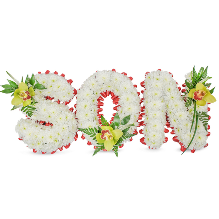 A refined and deeply respectful floral presentation spells 'SON' in bold, three-dimensional letters made from a sea of tiny, immaculate white chrysanthemums. The dense clusters of blooms give each letter a rounded, sculpted presence that reads soft to the eye and gentle to the touch, set simply against a white background to keep attention on the composition. Along the edges of the letters a vivid red ribbon is worked into a series of scalloped loops, the satin sheen of the ribbon forming a poignant border that contrasts with the chrysanthemums' matte white surfaces. Each letter is punctuated by a lime-green Cymbidium orchid - one on the upper left of the 'S', one cradled inside the lower part of the 'O', and a third near the top right of the 'N' - each orchid showing a warm reddish-brown mark within its throat and surrounded by lush green leaves and slender fern fronds that lend vertical lines and soft movement.

The overall effect, captured under soft, diffused lighting, balances solemnity with tenderness; the orchids' waxy texture and the chrysanthemum's cushion-like massing create depth and a quiet, comforting contrast. Speaking as a local florist familiar with Queensbury and the surrounding streets towards Kingsbury and Burnt Oak, this kind of personalised sympathy piece is chosen to convey unmistakable affection and remembrance at funeral services and graveside gatherings. The thoughtful placement of each accent, the crisp palette of white, red and green, and the handcrafted ribbon edge all speak to a careful, experienced floral hand crafting a fitting tribute for a beloved son.