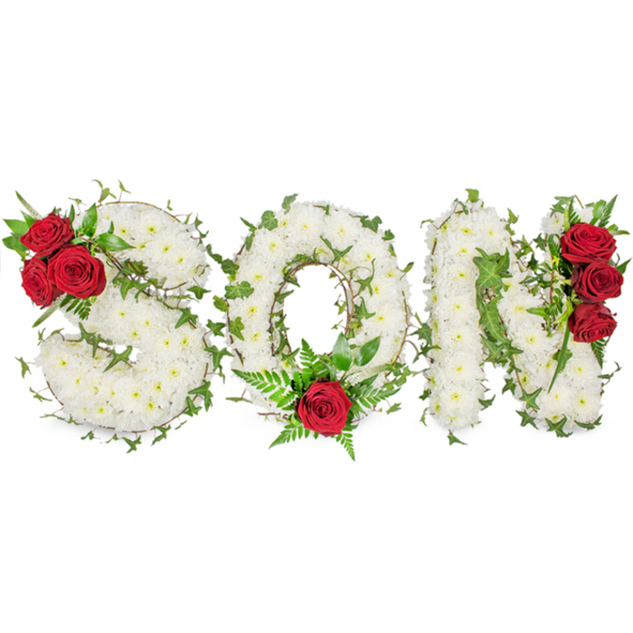 A striking, deeply felt memorial arrangement spells the letters SON in bold, capital form, each letter expertly constructed from hundreds of small, white spray chrysanthemum blooms that create a carpeted, satin-like surface of pure remembrance against a stark white background. Throughout the three letters, glossy ivy vines are gently interlaced, their green leaves tracing the contours and adding sculptural definition and a suggestion of eternal life. Poignant focal accents of deep red roses are placed with considered balance: the S bears a cluster of three full red roses tucked into its upper-left curve with supporting dark foliage, the O is anchored by a single prominent red rose set at its lower centre and cradled by fine fern fronds, and the N carries a vertical trio of intense red roses along its right-hand side. The colour relationship - pure white, vibrant green and passionate crimson - is deliberately chosen to convey purity, living memory and enduring affection. Bathed in natural light, the arrangement reveals subtle textures: the tiny chrysanthemum petals, glossy ivy, velvety rose faces and the airy green of the ferns. For families in Queensbury, near the Tube and local parks, this kind of personalised letter tribute offers a meaningful option for chapel or graveside; at Flower Delivery Queensbury we take care with each stem so the piece reads as both a visual and tactile expression of condolence, crafted to comfort and to honour a beloved son.