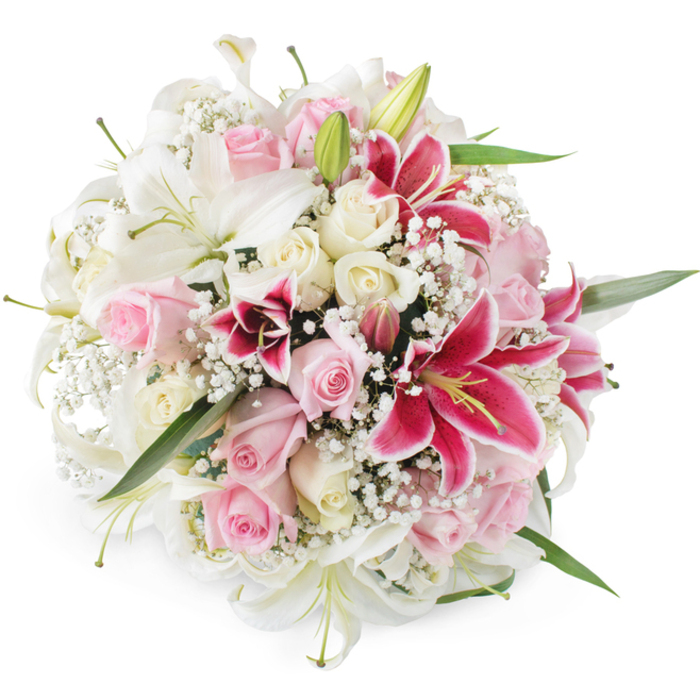 This image shows a beautifully balanced, round bouquet of lilies, roses, and baby's breath, set against a stark white background that accentuates every detail, much as the bright shop lights do in a local Queensbury florist's studio. The eye is first drawn to the generous white lilies, their long petals unfurling like satin ribbons, creating star-shaped blooms with soft green centres and subtle yellow stamens. Around and between them, roses in gentle blush pink and warm ivory tones add a sense of classical romance. Some of these roses are just beginning to open, their outer petals cupped protectively around the inner swirl, while others are in full bloom, revealing layers of velvety softness. Punctuating this pastel harmony, rich fuchsia and magenta Oriental lilies provide a vibrant contrast. Their petals deepen in colour toward the centre and are marked with fine speckles, giving them a bold, dramatic character that anchors the composition. Fine sprays of white gypsophila lace through the bouquet like tiny stars, filling negative space and lending the arrangement a gentle, cloud-like lightness. Slender green leaves and stems offer a fresh botanical frame, just visible around the densely packed flowers, hinting at careful hand-tying and professional craftsmanship. The lighting is bright and even, with no harsh shadows, allowing the natural colours to appear vivid yet refined. Overall, the bouquet radiates joy and elegance, evoking the feeling of a special delivery arriving at a home off Stag Lane or near Queensbury Park, ideal for weddings, anniversaries, or simply sending love and congratulations within the local community.