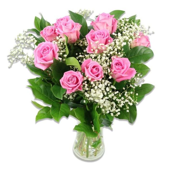 A beautifully composed bouquet of pink roses and white baby's breath is presented in a clear glass vase, photographed against a spotless white background that allows every detail to stand out, much like a carefully arranged gift on a Queensbury living room table. The arrangement features around a dozen pink roses in various stages of bloom, from tightly formed buds hinting at future petals to fully opened blossoms where each layer of velvety pink unfurls gracefully. The colouring is soft and feminine, with blush-pink outer petals and slightly deeper pink centres that give the bouquet gentle depth rather than bold contrast. Nestled among the roses are plentiful clusters of white Gypsophila, often called baby's breath, whose tiny, frothy flowers form a light, cloud-like veil around the more substantial rose heads. This pairing of pink and white suggests sweetness and innocence, making it a natural choice for baby flowers or to welcome a new mum home along Church Lane or in the streets off Queensbury Circle. The arrangement is encircled with glossy green leaves, mostly from the rose stems themselves, which provide a rich backdrop and help accentuate the bouquet's rounded, bountiful shape. The stems are gathered neatly in a straightforward, cylindrical glass vase, and through the clear sides you can see the green stalks and clear water, giving an impression of freshness and care in conditioning. Soft, balanced lighting catches the subtle sheen on each leaf and the velvety surface of the petals without harsh shadows, creating a calm, elegant mood. Overall, the image conveys a sense of tenderness, celebration, and gentle joy that feels perfectly at home in Queensbury when marking the arrival of a new baby or sending warm congratulations to growing families.