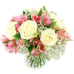 A beautifully composed bouquet of white roses, pink alstroemeria, and airy baby's breath sits against a pure white backdrop, the simple setting drawing attention to the intricate play of colour and texture. The roses, generously scattered throughout the domed arrangement, are a creamy white with a gentle hint of butter-yellow deep in their centers, their layered petals forming soft, rounded blooms that suggest grace and calm. Between them, stems of alstroemeria unfurl clusters of trumpet-shaped flowers in vivid fuchsia and soft blush pink, each petal lightly brushed with darker streaks and freckles that add a painterly detail to the design. Fine sprays of white Gypsophila weave delicately through the bouquet, filling small gaps with a light, cloud-like texture that makes the entire arrangement feel fuller and more romantic. Rich green foliage, slightly glossy and fresh-looking, frames the composition and provides a natural contrast that enhances the brightness of the white and pink flowers. The stems are clearly visible at the base, aligned and bound in the style of a traditional hand-tied bouquet, as you might receive from a trusted local florist in Queensbury after a visit to the shops near the station or a walk through the nearby residential streets. Soft, even light seems to wash over the flowers, creating gentle shadows that emphasise their depth and freshness, as if they have just been arranged. The bouquet feels ideal for expressing heartfelt sentiments-a thoughtful birthday surprise, a tender anniversary gesture, or a simple "thinking of you" delivered to a home, office, or small business around Queensbury and the surrounding HA8 area.