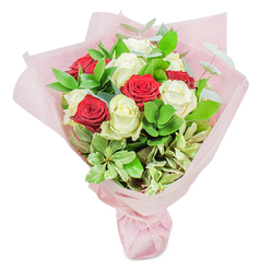 Crafted with Queensbury's unique character in mind, this enchanting bouquet weaves together the classic symbolism of red and white roses into a harmonious gesture of love and admiration. The deep, velvety reds pulse with emotion and intimacy, beautifully offset by white blooms that gleam like pearls under the clear borough sky. Around these showstoppers, lush green foliage unfurls-choose ruscus and eucalyptus for texture, with touches of creamy variegated greenery lending subtle sophistication. Each leaf shimmers under the soft natural light, like dappled sunlight on the quiet paths near Roe Green Park. Carefully arranged in airy, blush-toned floral paper, the wrapping adds both an ethereal touch and a gentle contrast to the vibrant colours within. The arrangement is not merely visual; it evokes aromas of fresh gardens after rain, inviting feelings of calm and renewal. This sophisticated bouquet, perfect for special occasions like milestone birthdays, heartfelt anniversaries, or generous thank-you gifts, epitomises the quiet luxury and attention to detail that define local floristry in Queensbury. When prepared by one of our seasoned florists, each bouquet becomes more than just flowers-it's a multisensory gift, thoughtfully tailored to brighten someone's day and reflect the genuine warmth of the Queensbury community.