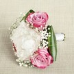 This romantic bouquet evokes the gentle spirit of Queensbury with a harmonious blend of classic and contemporary floral artistry. Encircled by sleek, vibrant green leaves, the arrangement's centerpiece is a luxuriously layered white peony whose ruffled petals conjure visions of soft clouds drifting above local gardens. Three vivid pink roses nestle around the peony, their petals blooming with a gradient from bold magenta at the tips to the tenderest blush pink and lavender within-a visual echo of joyful celebrations held in the area's elegant venues. Delicate trails of gypsophila thread through the bouquet, introducing a subtle, airy movement like the whisper of spring across Roe Green. The bouquet's handle is secured with a polished white satin ribbon, enhancing its refined finish and readiness for ceremonial walks down aisle or heartfelt presentations. Resting upon a neutral, textured background that amplifies every colour and contour, the arrangement feels imbued with emotion-expressing love, unity, and hope for new memories. Crafted by experienced hands at Flower Delivery Queensbury, this bouquet is a timeless choice for everything from intimate weddings in NW9 to meaningful occasions shared with loved ones throughout the local neighbourhood.