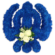 A bold Sikh Khanda floral tribute fills the frame, crafted entirely from rich royal blue blossoms that turn this sacred emblem into a striking work of living art. The central sword rises straight and true, flanked by the perfect circle of the chakkar and two graceful, curved kirpans, all sharply defined by the careful placement of small, tightly packed chrysanthemum heads. Their layered petals create a plush, almost quilted effect, so the surface looks soft to the touch despite its strong, angular form. The blue hue is intense yet serene, recalling the deep tones often seen in ceremonial fabrics and turbans at local Queensbury gatherings. Against a bright white backdrop, the colour appears even more saturated, and gentle shadows around the edges give the tribute a sense of depth, as though it rests on a table in a quiet chapel or family living room. Nestled at the base of the central blade sits a gentle heart of white and green flowers. Three white roses, fully yet delicately open, are surrounded by sprays of tiny white blossoms and accented with dark green foliage, offering a peaceful contrast to the surrounding blue. The roses seem to glow softly, suggesting purity, compassion, and the blessing of a life well lived. This arrangement could easily be imagined at a Sikh funeral service in or around Queensbury, perhaps accompanying prayers and hymns shared by family and friends. It conveys a blend of solemnity and comfort, capturing both the strength of Sikh identity and the tenderness of farewell.