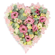 A tender, heart-shaped floral tribute is presented on a pure white background, its pastel hues and careful craftsmanship creating an immediate sense of gentle solace, like a comforting gesture offered at a quiet funeral home in Queensbury. The outline of the heart is clearly defined by a narrow band of soft pink satin ribbon, which traces the curves with a subtle sheen and gathers into neat, decorative bows at both the top indentation and the lower point, adding an elegant finishing touch. Within this frame, the florist has packed the heart generously with blossoms, so that the arrangement appears full, plush, and seamless. The main body is formed by ruffled pink lisianthus and frilly, light pink carnations, their petals overlapping and curling to create a richly textured surface that suggests tenderness and care. Nestled among these are clusters of small, creamy yellow and pale ivory roses or lisianthus heads, whose gentle tones bring a hint of sunshine and warmth to the predominantly pink composition. Tiny white daisy-type flowers with yellow centers are sprinkled throughout, introducing a note of innocence and fresh countryside charm. Silvery-green eucalyptus leaves, with their rounded, almost coin-like shapes, are interspersed with darker, variegated foliage, adding depth, structure, and a cool, calming counterpoint to the soft blossoms. The combination of colours and textures-blush pink, cream, pale yellow, and muted greens-creates a soothing, harmonious effect. This heart-shaped tribute would be a fitting choice for a funeral service or memorial gathering in Queensbury, expressing enduring love, remembrance, and quiet support for grieving families while showcasing the skill of a local artisan florist.