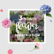 A luxurious pastel bouquet from a three-month flower subscription is pictured as though just unwrapped in a Queensbury home, its colours unfolding softly against a calm, neutral background. At its base, voluminous clusters of pale blue hydrangeas spread out in rounded domes, every tiny floret adding to a sense of cloud-like fullness. Rising from this cool foundation, roses in shades of blush, soft pink, and gentle lilac are placed with deliberate care, some with fully opened rosettes showing elegant spirals, others still in tighter buds promising days of gradual unfurling. Fine lisianthus stems meander through the arrangement, offering delicate, frilly blooms that introduce lightness and movement, like a breeze passing through a garden near Queensbury's quiet residential streets. Fresh greenery, in varied shapes and tones of green, cups the flowers and edges the bouquet, suggesting leaves just cut from the garden and giving the design depth and a natural frame. The light falls from one side, as if streaming through a front-room window, highlighting the velvety textures of the roses and the softly quilted surface of the hydrangeas. You can almost imagine a subtle blend of scents-sweet, floral, and gently green-drifting into the room. The overall feel is nurturing and composed, ideal for placing on a dining table or mantle where it can be admired over several days. It speaks to the joy of knowing another arrangement will follow next month, each delivery a quiet reminder of care, celebration, and the seasonal beauty that can be brought to everyday life in Queensbury.