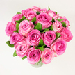 A generous, hand-gathered bouquet of roughly two dozen fresh pink roses sits in a simple clear glass vase against a clean white backdrop, captured from a slightly elevated, overhead angle that highlights its rounded, abundant form. Each rose is open or nearly open, layers of velvety petals unfurling from deep fuchsia or magenta at the heart to softer rosy pinks and pale blush tones toward the edges, creating a natural ombré that gives the cluster depth and movement. Dark green, glossy leaves are tucked between the blooms, their cool, verdant tones offering a crisp contrast that makes the pinks sing and reinforces the sense of freshly cut stems. Soft, diffuse lighting reveals subtle textures-the fine veining on petals, the satiny sheen where light catches, and the faint shadowing that rounds each bloom-while keeping the overall mood bright and airy. The arrangement reads as both classic and modern: a traditional rose bouquet refined by tight, thoughtful placement so it reads as one generous, joyful mass. There is an implied scent, a light powdery rose perfume that seems to hover just above the petals, and a tactile invitation to brush fingers across the silky layers. This floral portrait evokes romance, celebration, and quiet affection, making it equally at home as a heartfelt anniversary gift, a Mother's Day surprise, or a sophisticated centrepiece for a special table. As a Queensbury florist might say, it's the kind of bouquet neighbours in Kingsbury or near Queensbury station would send to mark moments that matter.