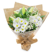 A serene bouquet of white and green flowers stands poised against a spotless white background, its simple beauty echoing the calm corners of Queensbury's tree-lined avenues. The arrangement is dominated by plentiful white daisy chrysanthemums, each bloom showcasing a circle of smooth, layered petals encircling a fresh yellow-green centre that adds a gentle, optimistic glow. Closely clustered, these daisies form a soft, cushion-like canopy of white, inviting the eye to linger. Rising from among them are several tall, unopened lily buds, their elongated forms sheathed in pale green, with subtle hints of creamy white at their tips. They stretch upward with poise, symbolising hope, renewal, and the blossoms yet to open. Woven delicately throughout are airy sprigs of baby's breath, each tiny white flower floating on thin stems to create a hazy, cloud-like texture that softens the entire composition. Surrounding the blooms, glossy dark green foliage folds and curves, offering depth, structure, and a lush contrast to the bright white petals. The stems are carefully gathered and wrapped first in rustic brown kraft paper, which brings a natural, earthy character reminiscent of local florists along Church Lane. A clear cellophane layer envelops the kraft paper, adding a light sheen and ensuring the bouquet remains fresh and secure during delivery across Queensbury and nearby areas. Neatly tied at the base, this hand-tied arrangement conveys purity, peace, and heartfelt compassion, making it especially suitable as a sympathy bouquet, a gentle get well gift, or a quiet expression of support during sensitive moments.