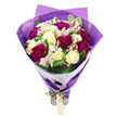 The image presents a thoughtfully crafted bouquet that captures the feel of a special delivery arriving at a doorstep in Queensbury. Set against a plain white background, the flowers appear luminous and fresh, their colours and textures clearly defined. At the centre, cream-white roses open in graceful spirals, their petals smooth and gently overlapping, creating a soft focal point that suggests purity and affection. Surrounding them, clusters of deep magenta carnations add richness and volume, their frilled petals overlapping densely to form plush, rounded blooms that contrast beautifully with the simplicity of the roses. Delicate white alstroemeria are tucked in between, each blossom marked with fine streaks of pinkish-red and subtle speckling, with dark stamens standing out against the pale petals, lending a sense of intricate detail. The arrangement is interlaced with fresh green foliage, some leaves a solid, glossy green and others edged with lighter variegation, giving the bouquet a naturally full and textured look, much like the varied planting in local gardens around Queensbury Circle and the surrounding residential streets. The stems are wrapped in a tidy inner layer of crisp white floral paper that forms a neat collar around the blooms. Over this, a crinkled sheath of translucent purple cellophane or tissue adds a soft sheen and a modern, celebratory feel, almost like a gift you might carry home from a favourite neighbourhood florist. At the base, a bright iridescent green satin ribbon cinches the wrapping tightly, tied into a neat bow. A small light brown rectangular tag dangles from the knot, ready to be inscribed with a personal note for birthdays, thank-you messages, or heartfelt well-wishes, reflecting the warmth and care behind local flower delivery in Queensbury.